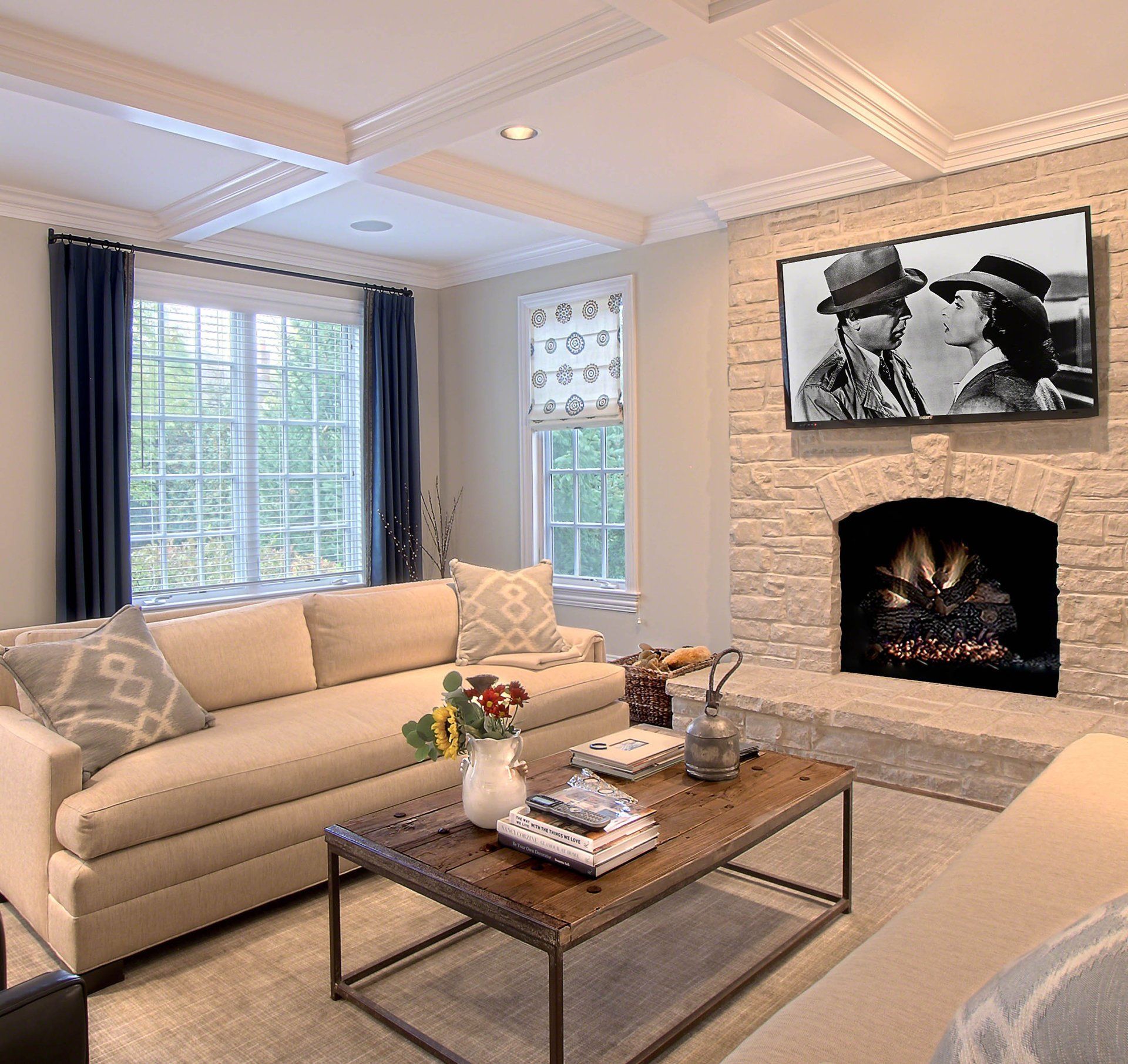 A living room with a couch a coffee table and a fireplace