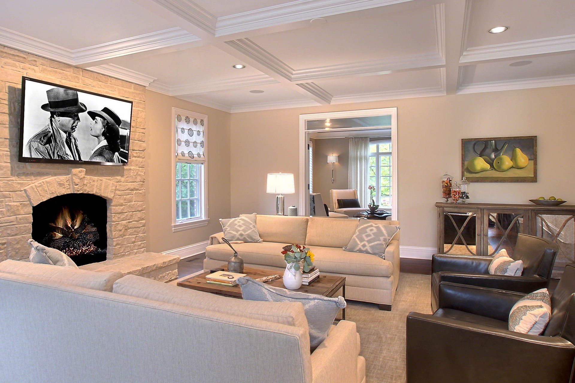 A living room with a fireplace and a flat screen tv