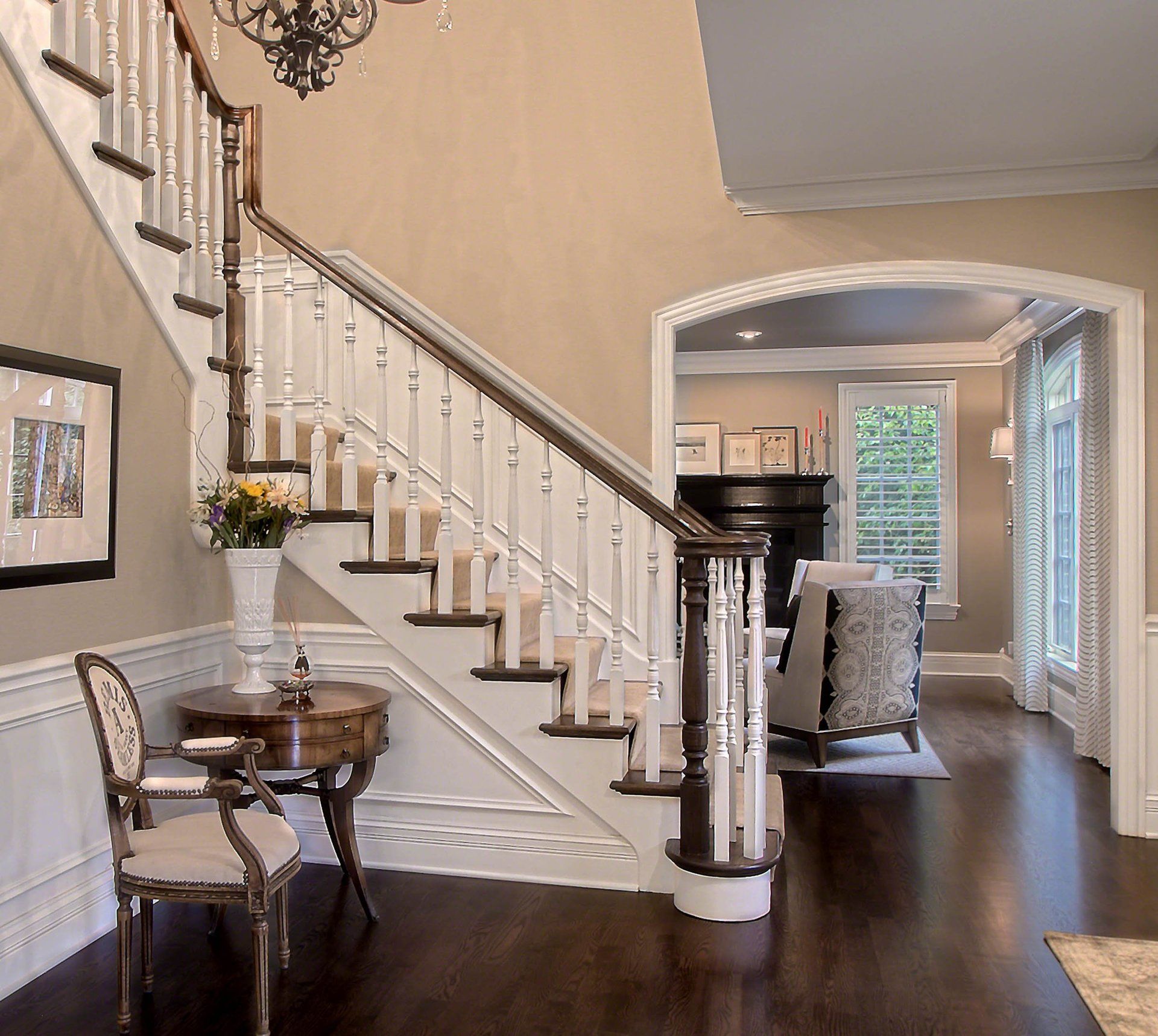 A staircase leading up to a living room in a house