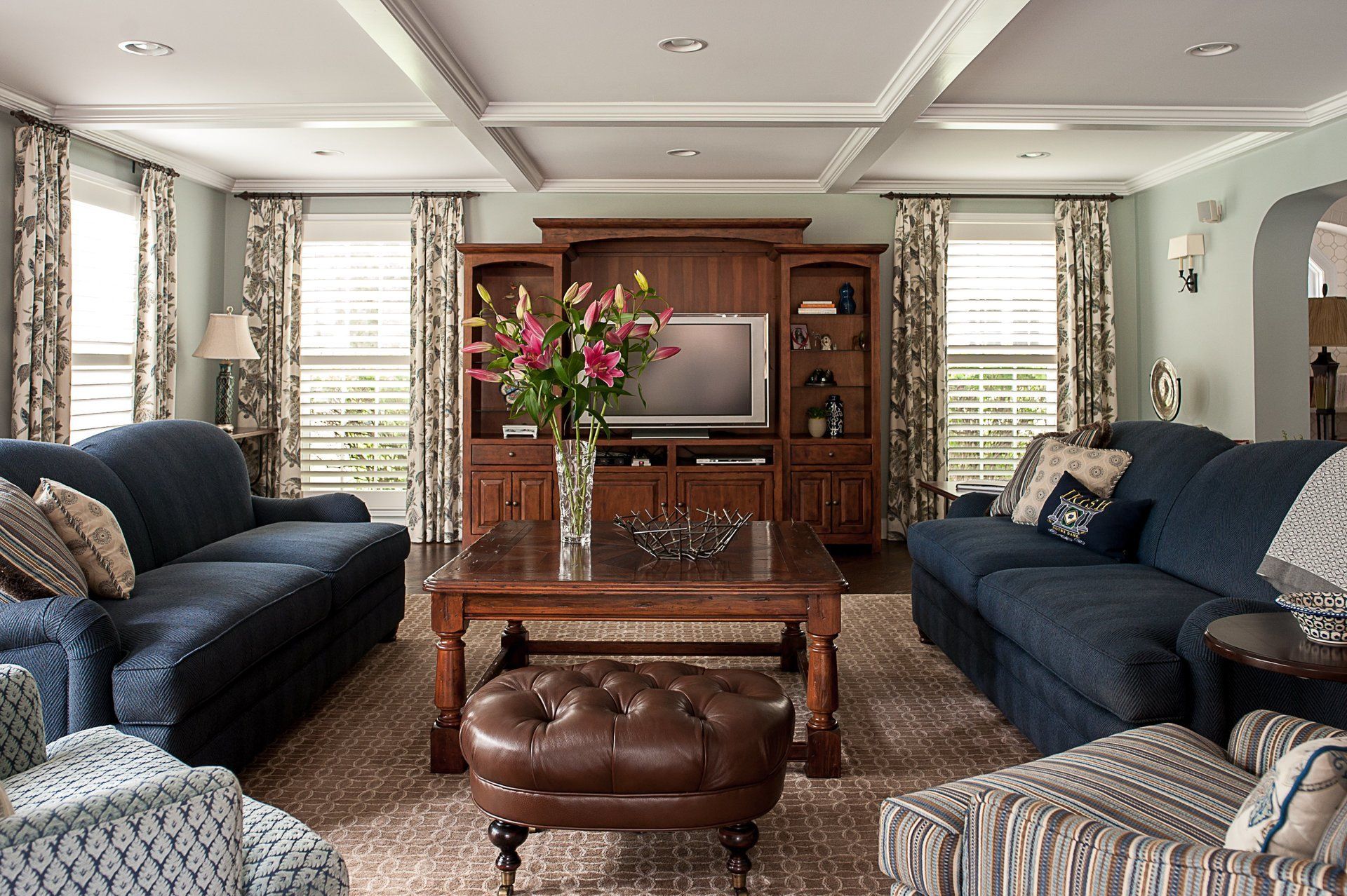 A living room filled with furniture and a television