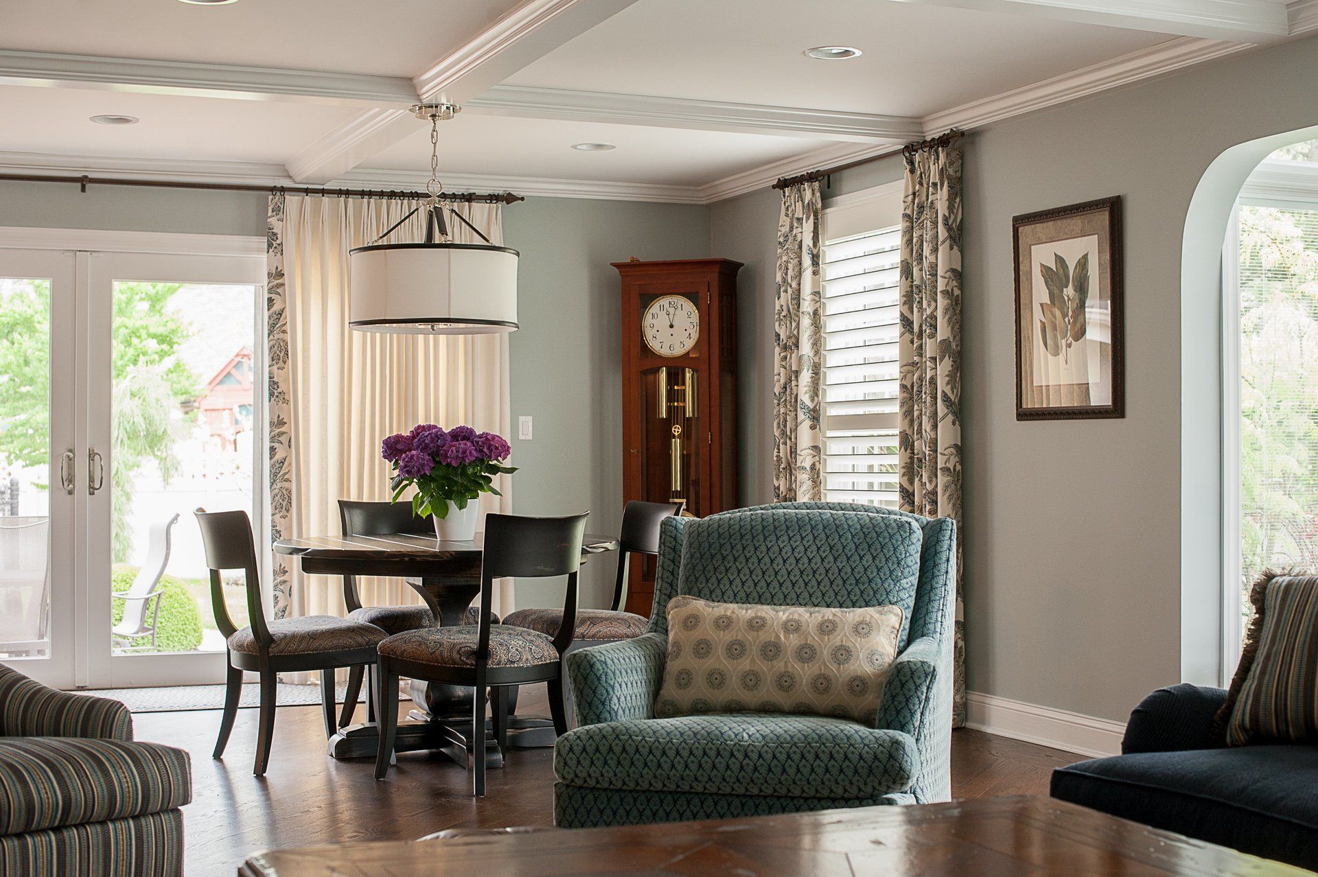 A living room filled with furniture and a large clock.