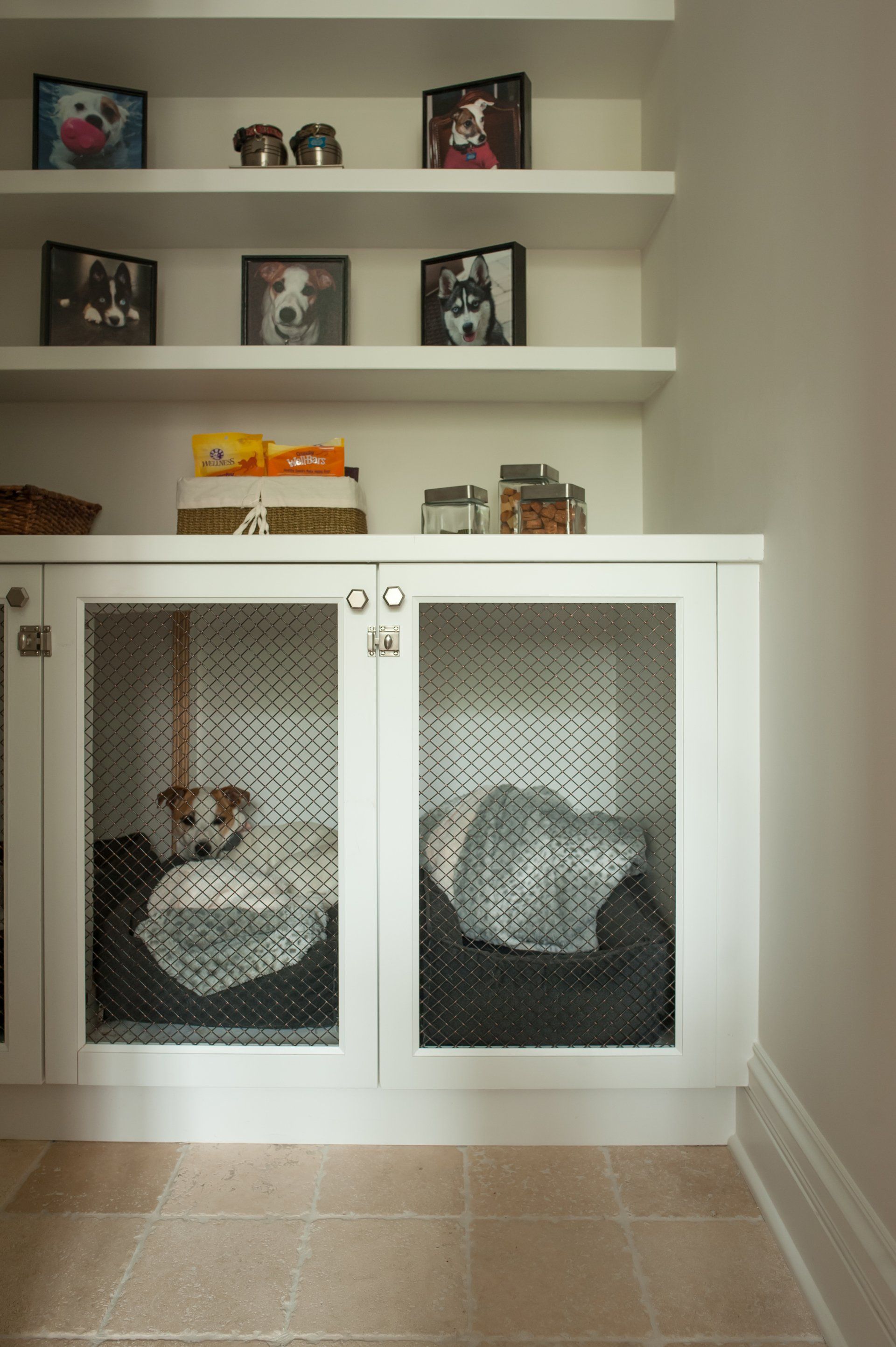 A dog is laying in a dog bed in a cabinet