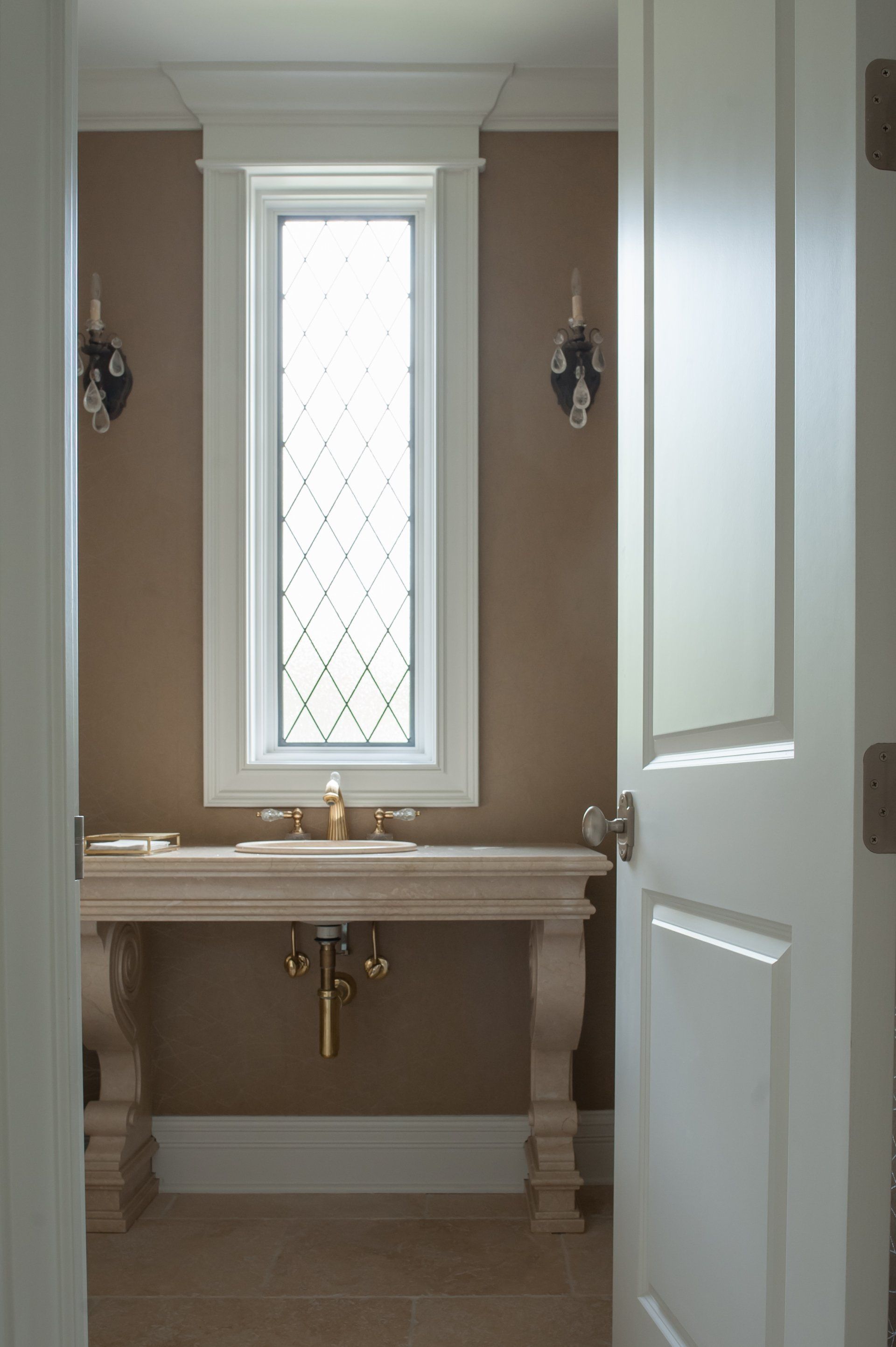 A bathroom with a sink and a large window