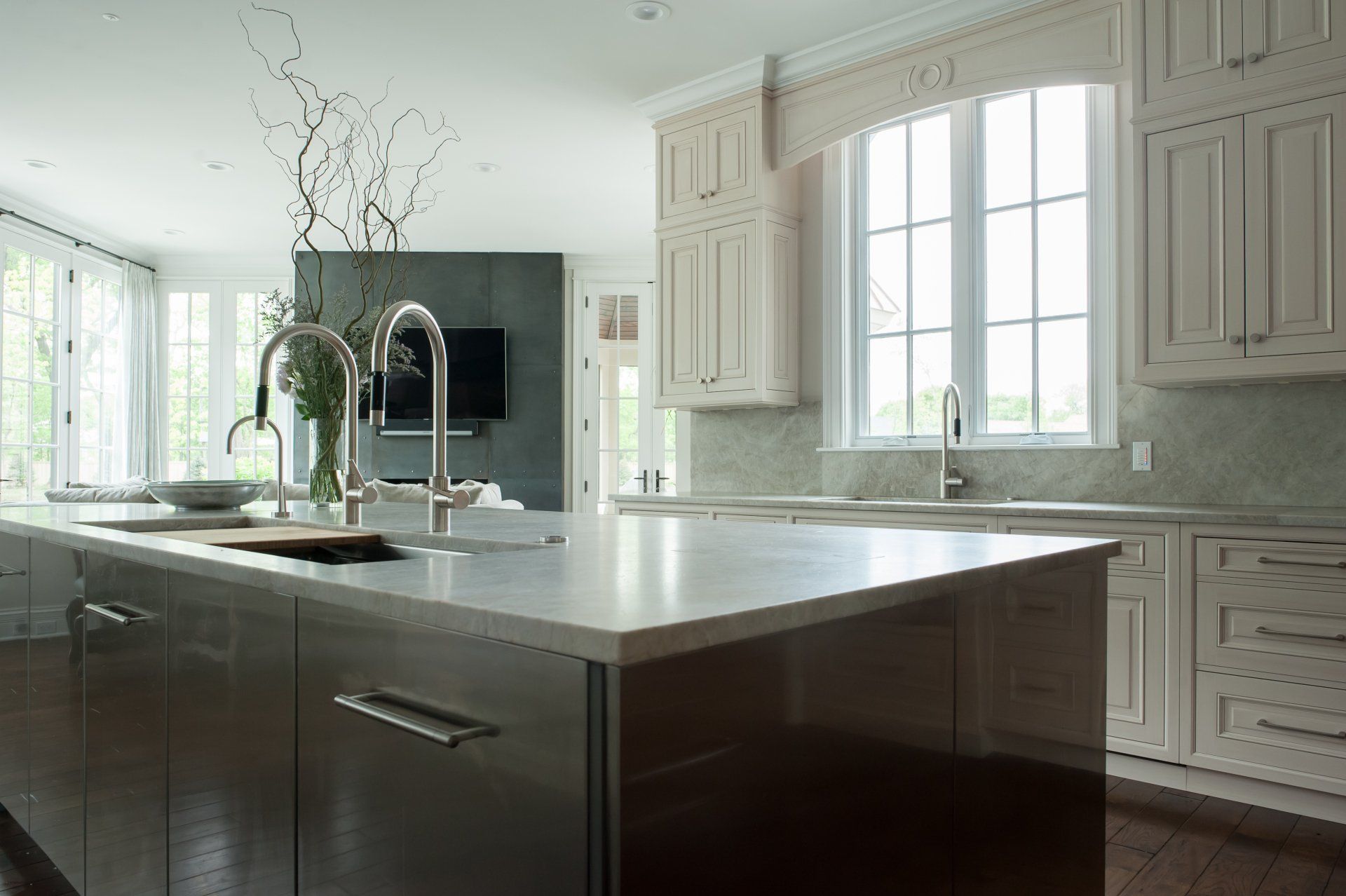 A kitchen with stainless steel cabinets and a large island