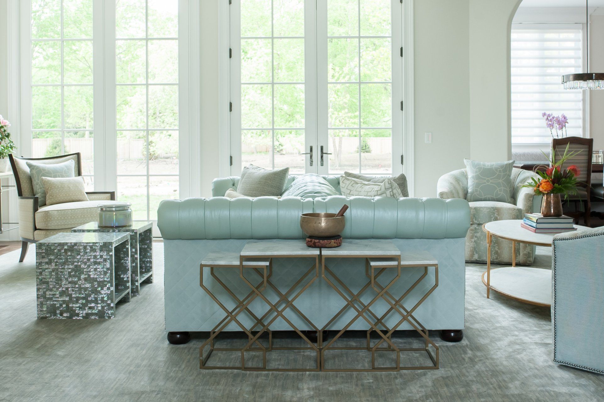 A living room filled with furniture and a blue couch.