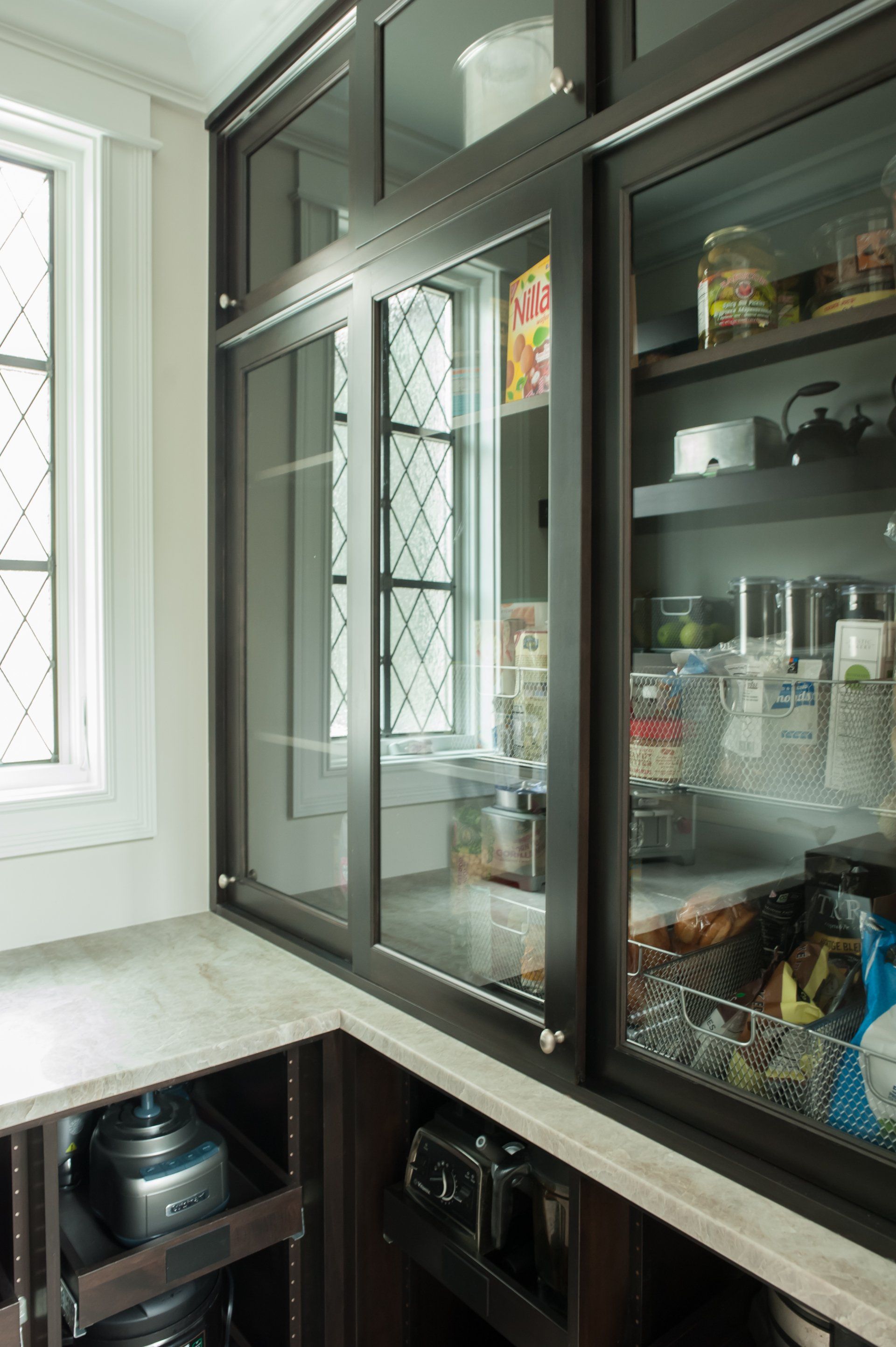 A kitchen with sliding glass doors and a window