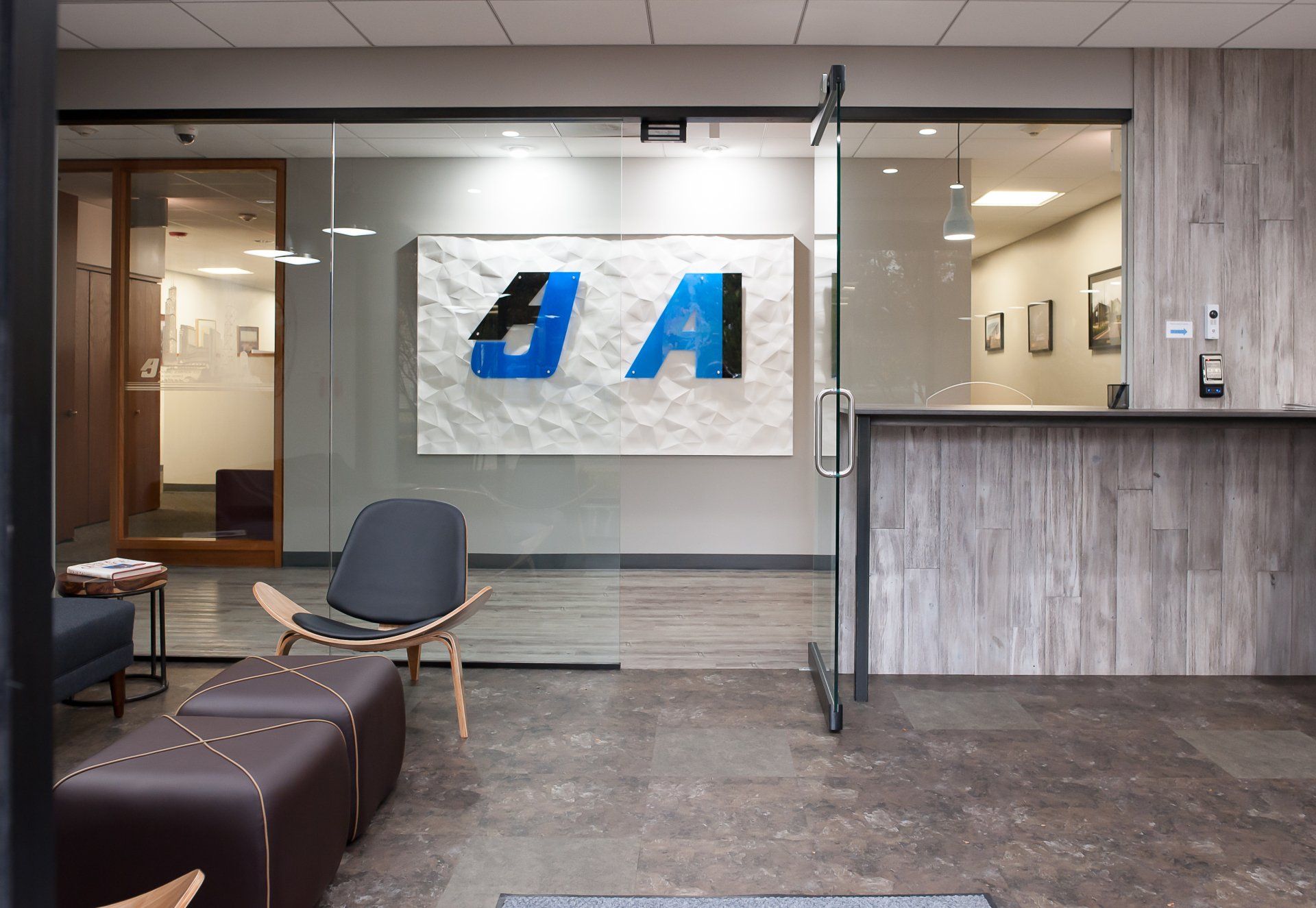 A lobby with a painting on the wall that says aa