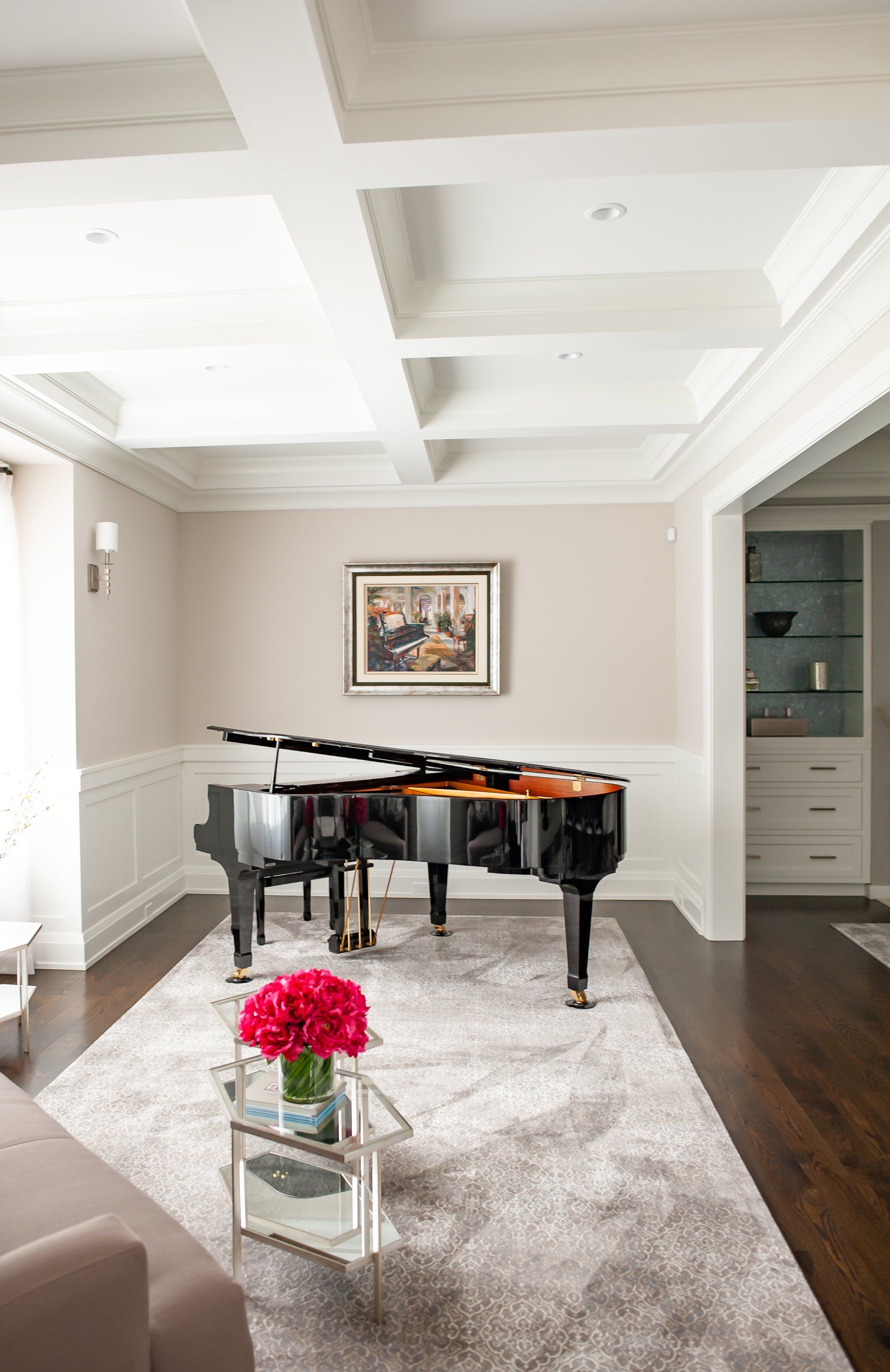 A living room with a piano and a coffee table.
