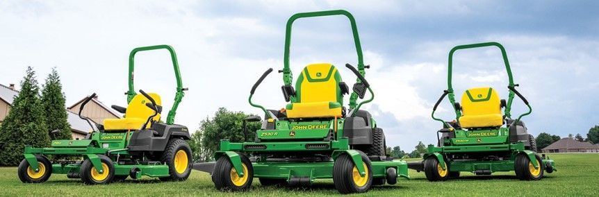 Three John Deere Lawn Mowers Are Parked in A Grassy Field | Onalaska, WI | River City Irrigation