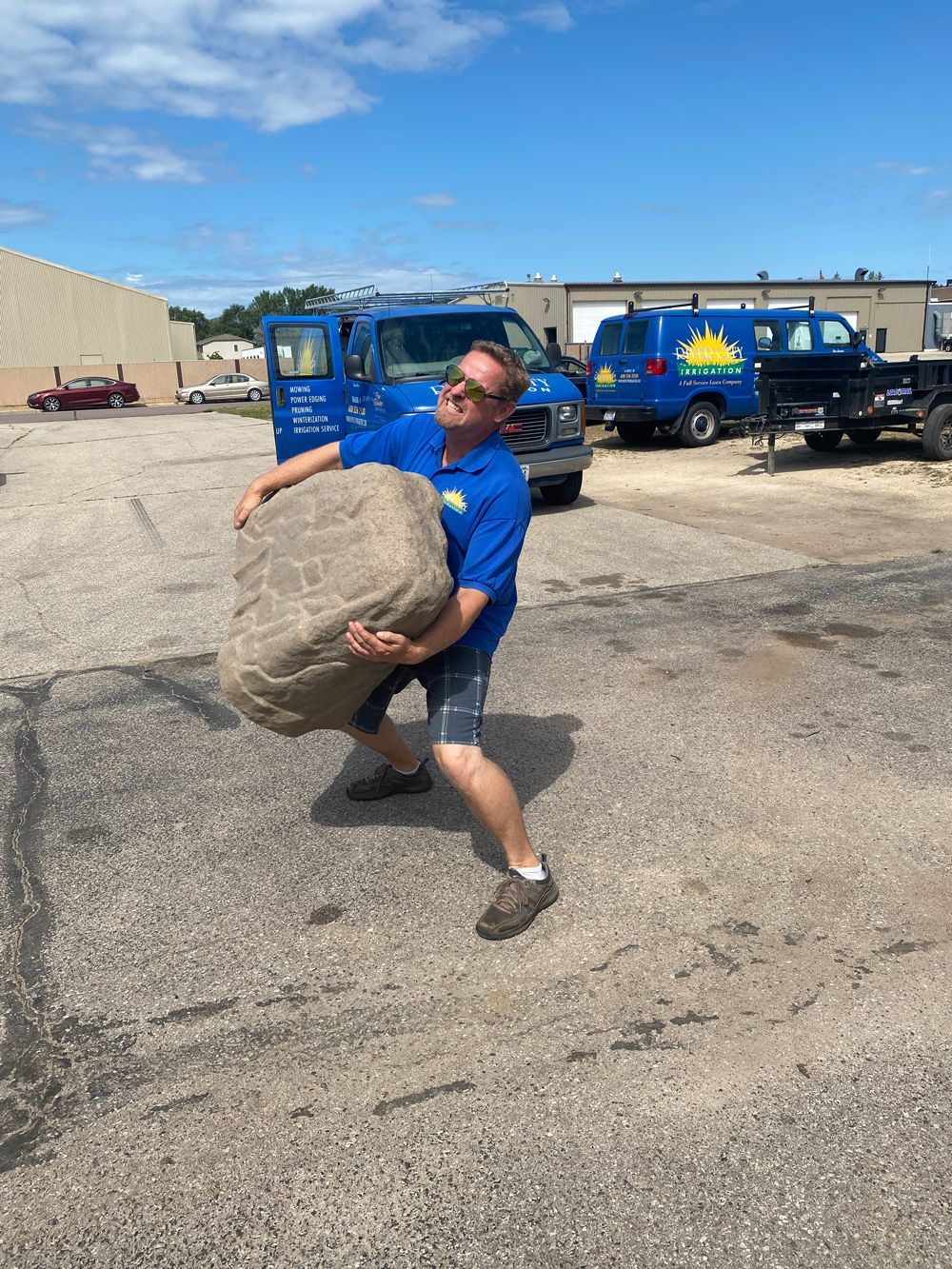 Man Lifting A Rock — Onalaska, WI — River City Irrigation