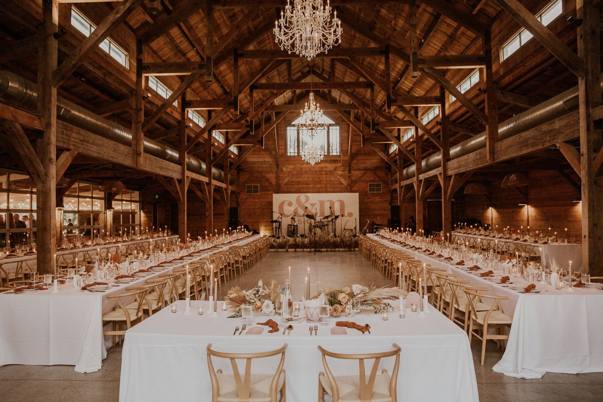 Indoor Reception with long white tables at The Addison Grove in Austin, Texas 