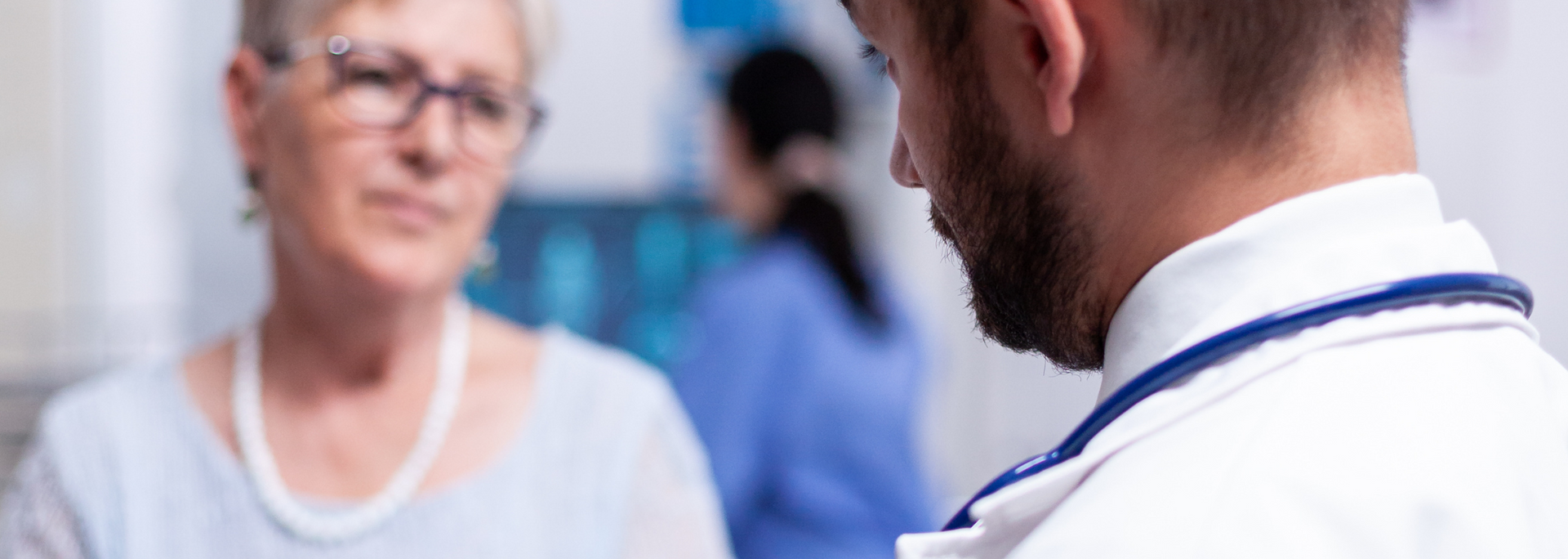 Picture of a person in a medical consultation with a doctor.