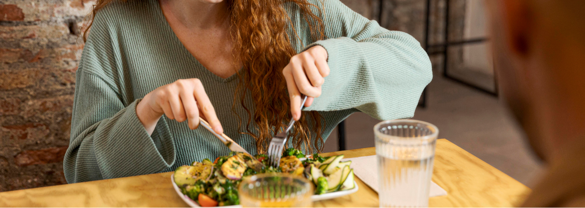 Picture of somebody sitting down for a healthy meal.