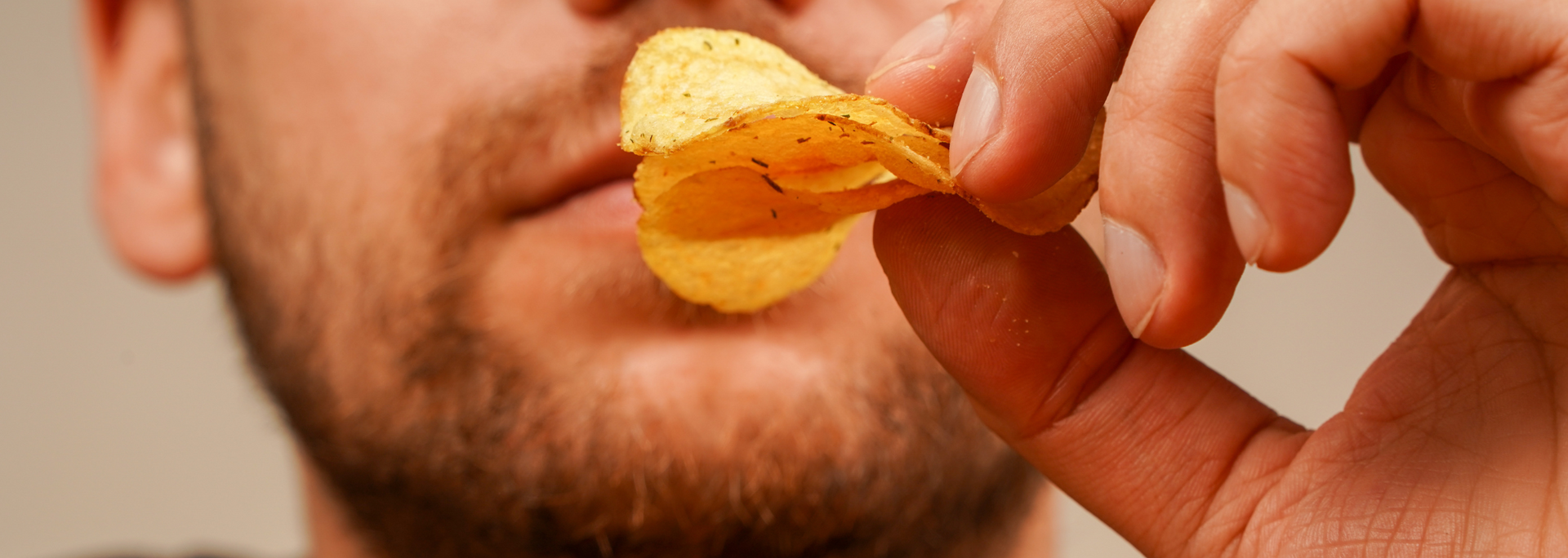 Picture of someone eating crisps. Picture of someone eating crisps.