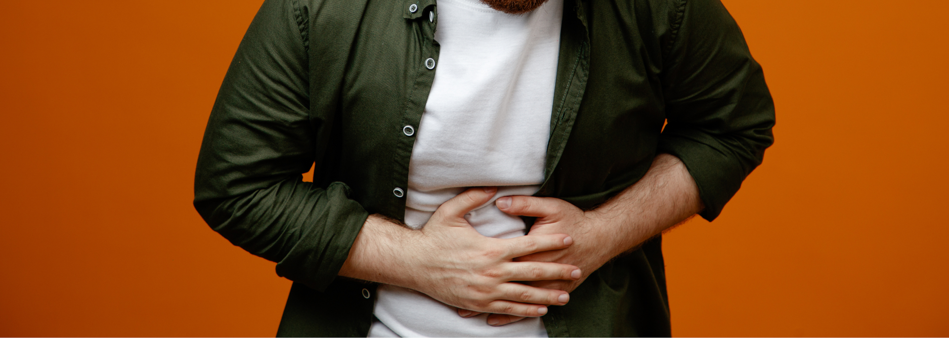 Picture of someone holding their stomach.