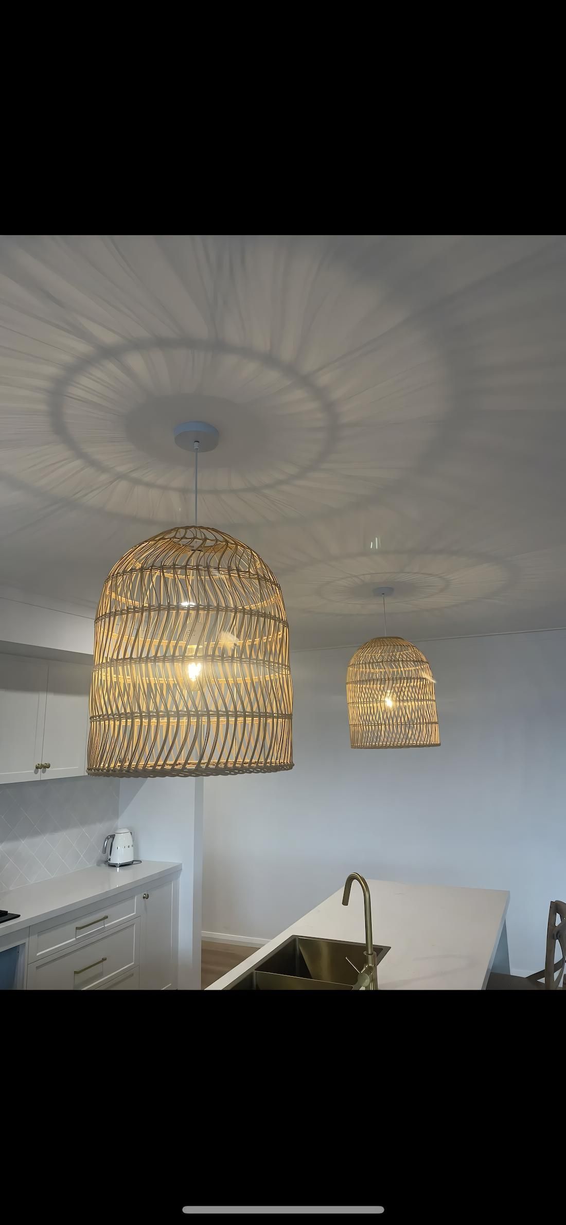 Two Woven Pendant Lights Hang Over a Kitchen Island — Switched On Electrics in Wagga Wagga, NSW