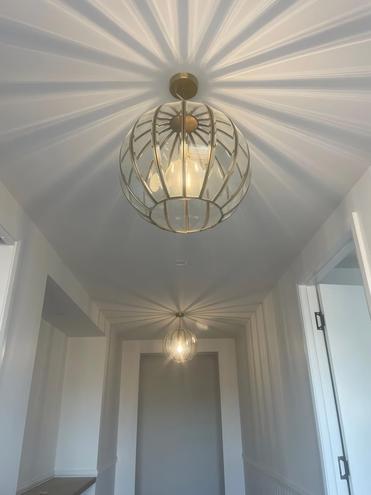 Gold Orb Pendant Lights Cast Sunburst Shadows — Switched On Electrics in Wagga Wagga, NSW
