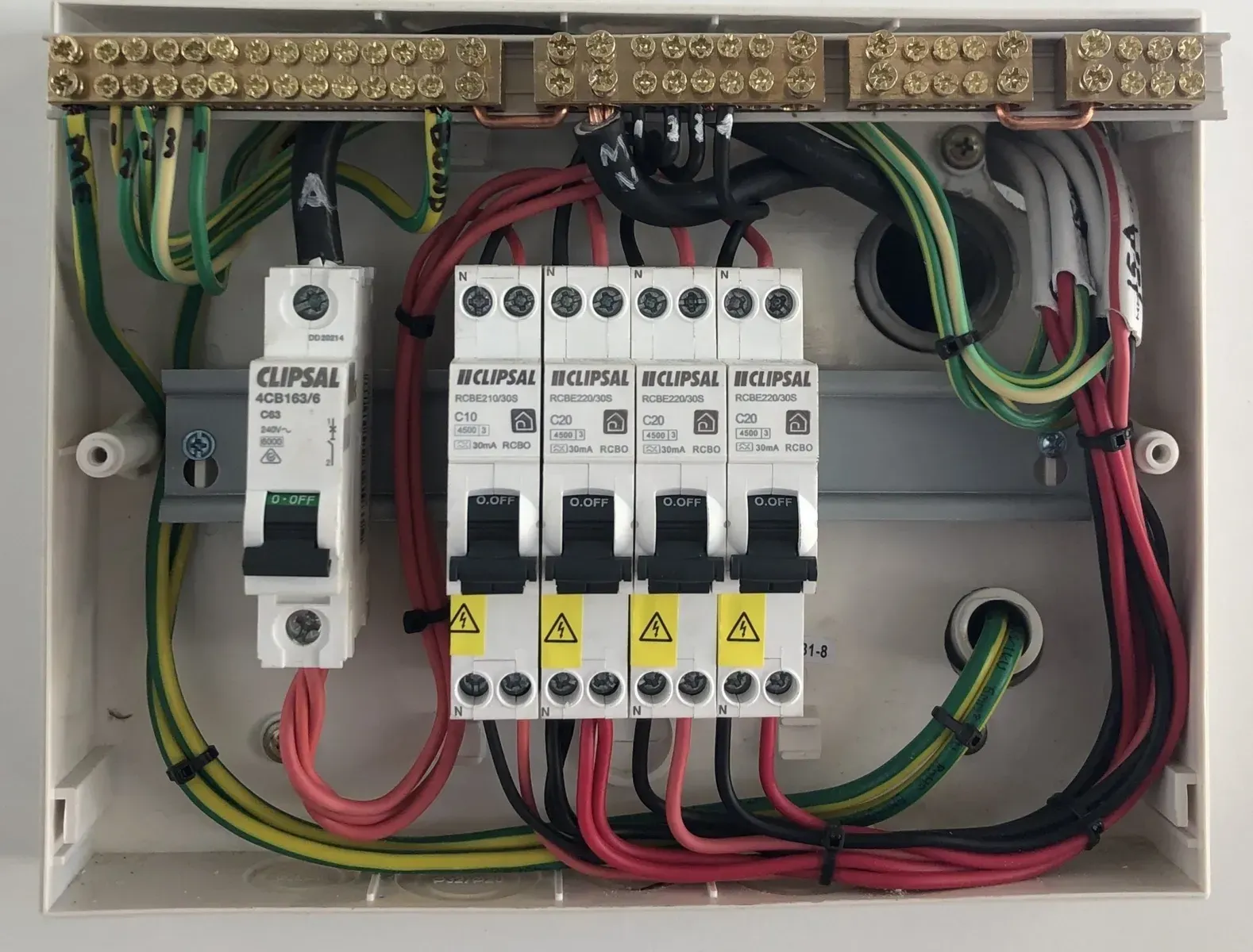 Electrical Panel With Circuit Breakers and Wiring in a White Box — Switched On Electrics in Wagga Wagga, NSW