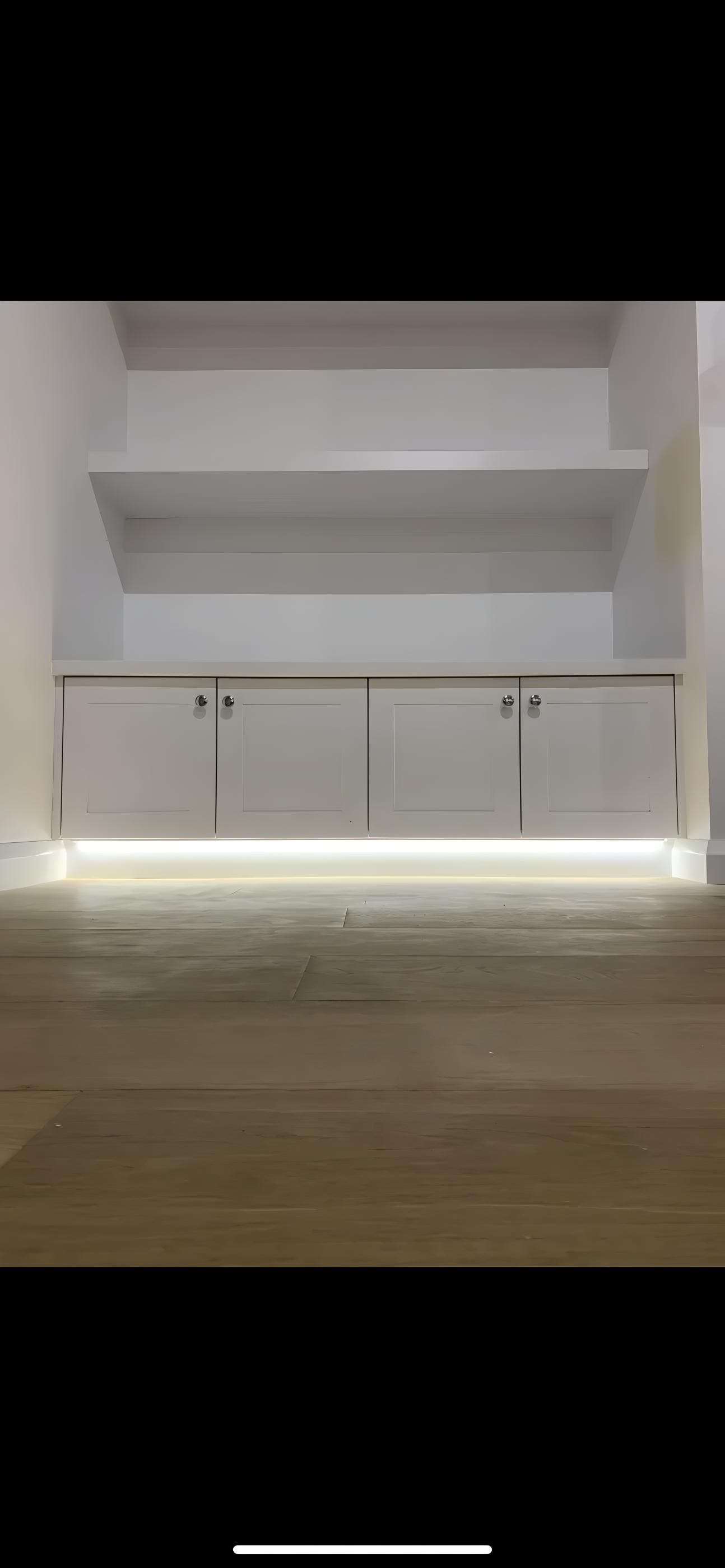 White Shelving Unit With Built-in Lighting Above a Wooden Floor — Switched On Electrics in Wagga Wagga, NSW