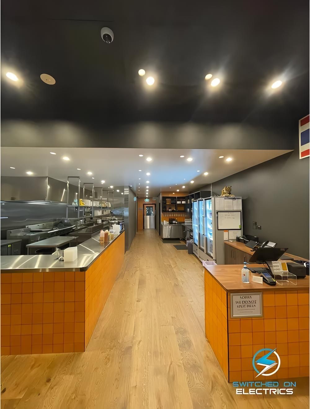 Interior of a Restaurant With Orange Counters, Wooden Floors — Switched On Electrics in Wagga Wagga, NSW