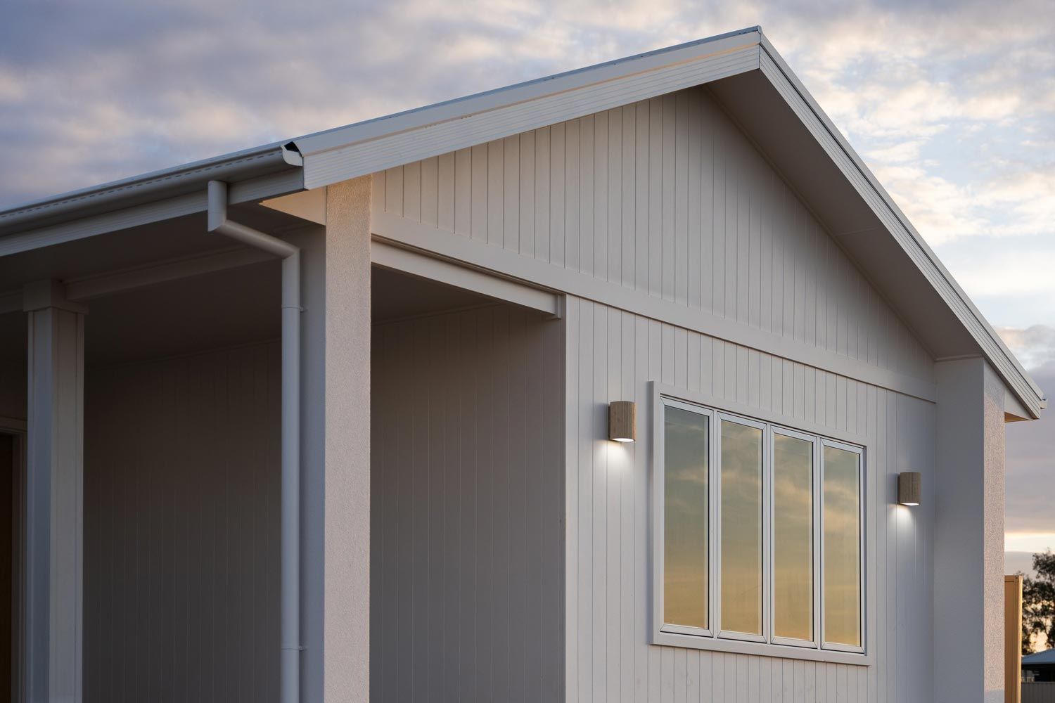 White Building With a Gabled Roof and Vertical Siding — Switched On Electrics in Wagga Wagga, NSW