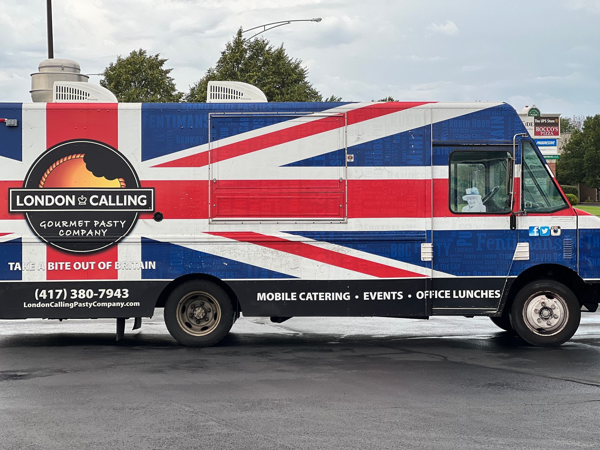 A london calling food truck is parked in a parking lot