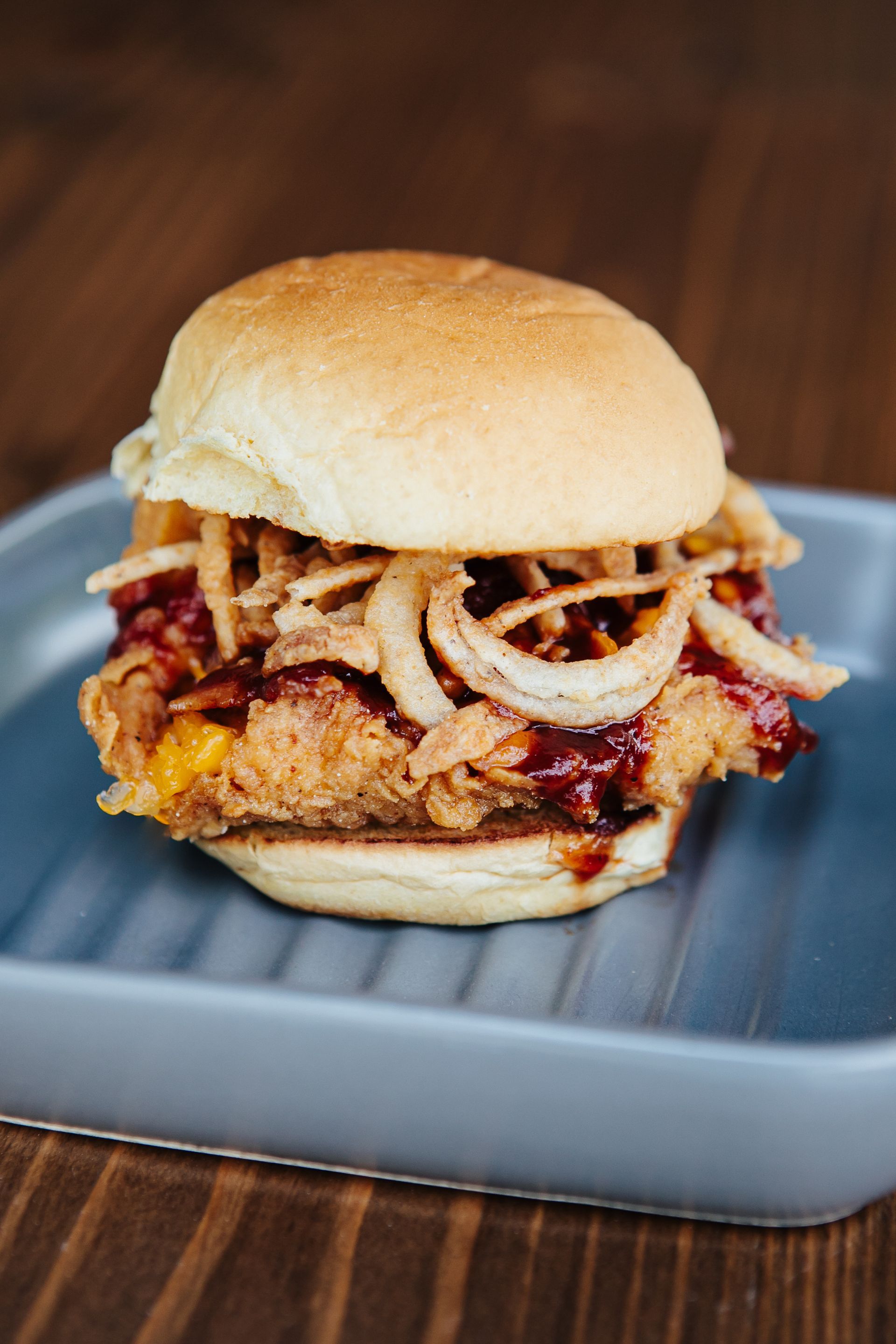 A close up of a sandwich on a plate on a table.