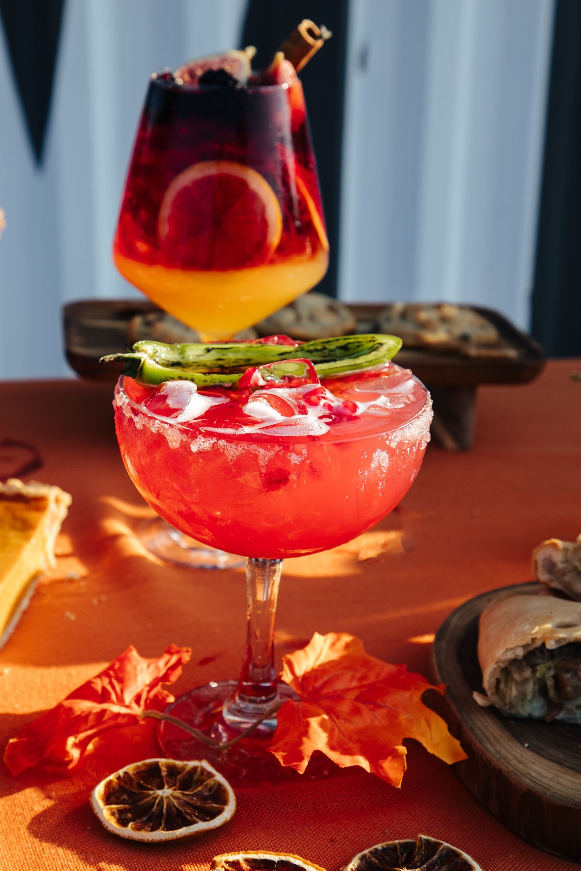 A close up of a margarita in a glass on a table.