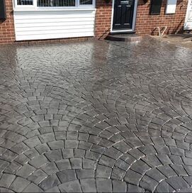 Dark grey imprinted patterned concrete Driveway