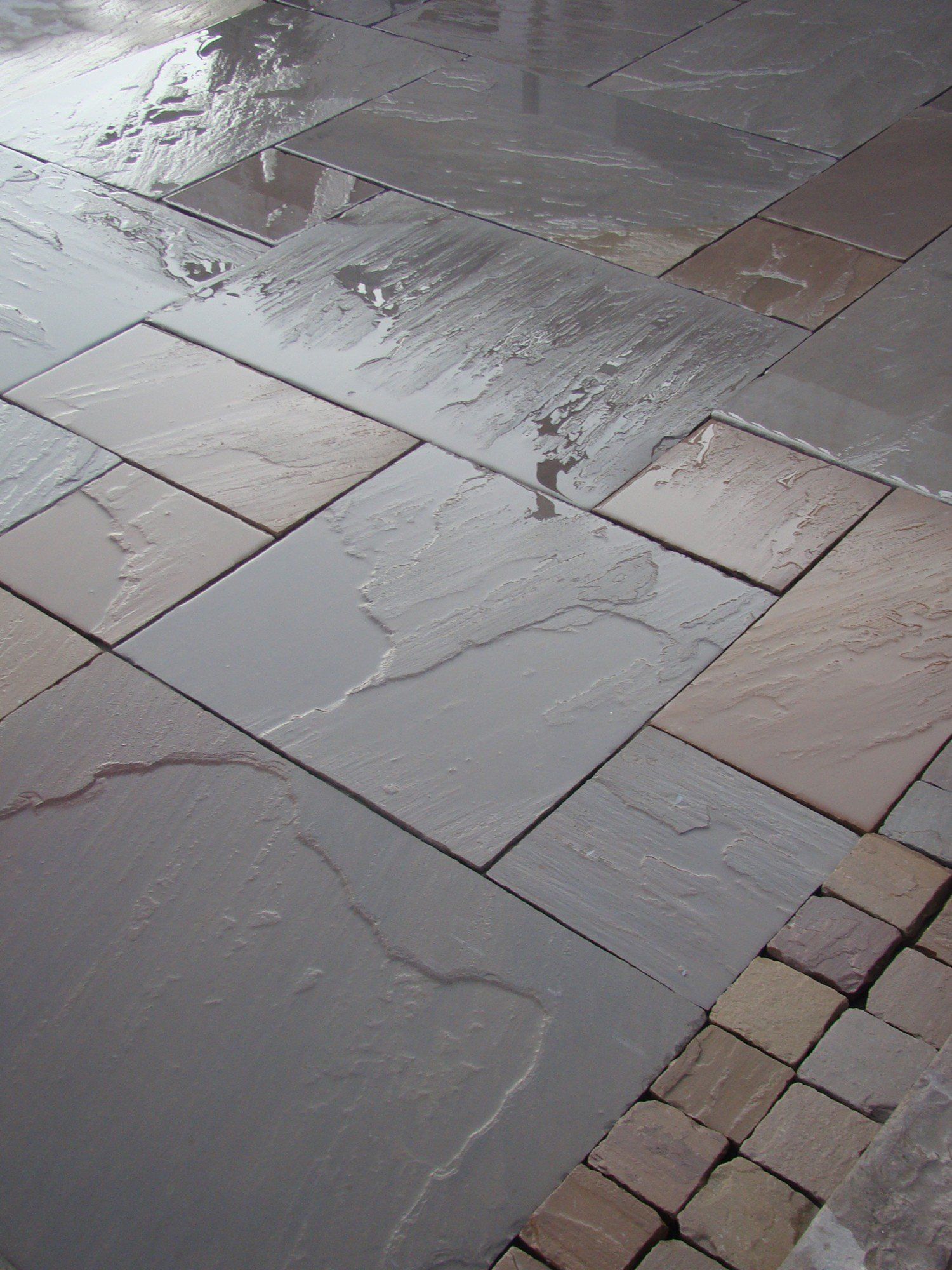 Dark grey Indian sandstone patio in Sheffield garden