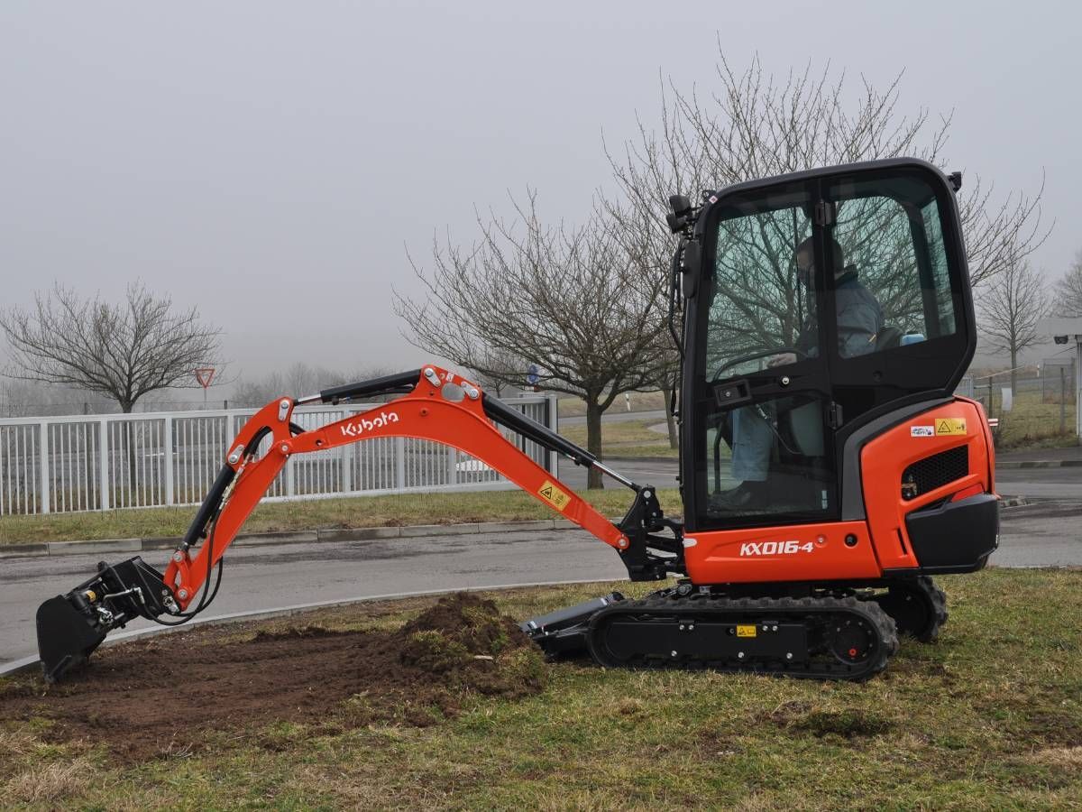 mini digger with driver starting groundworks in Sheffield