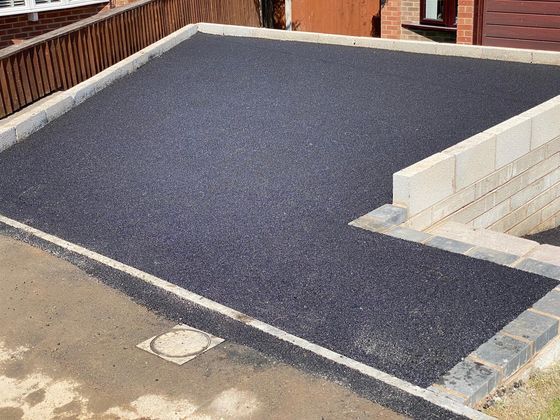 carved black tarmac driveway with block paving edging in Sheffield