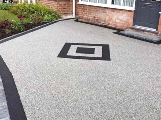 Driveways Sheffield light grey resin driveway with black edging and black feature pattern