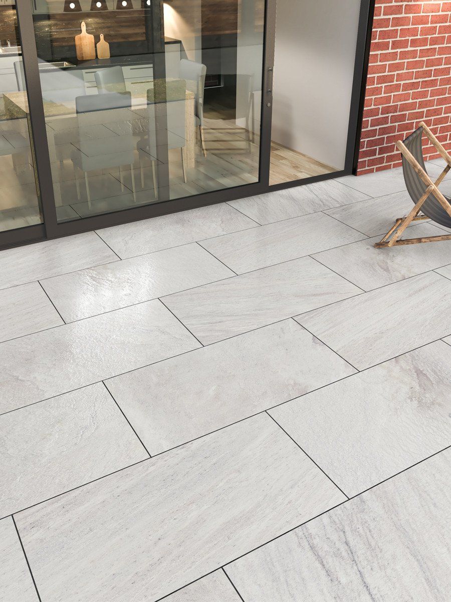 Light porcelain patio laid up to patio doors in Sheffield