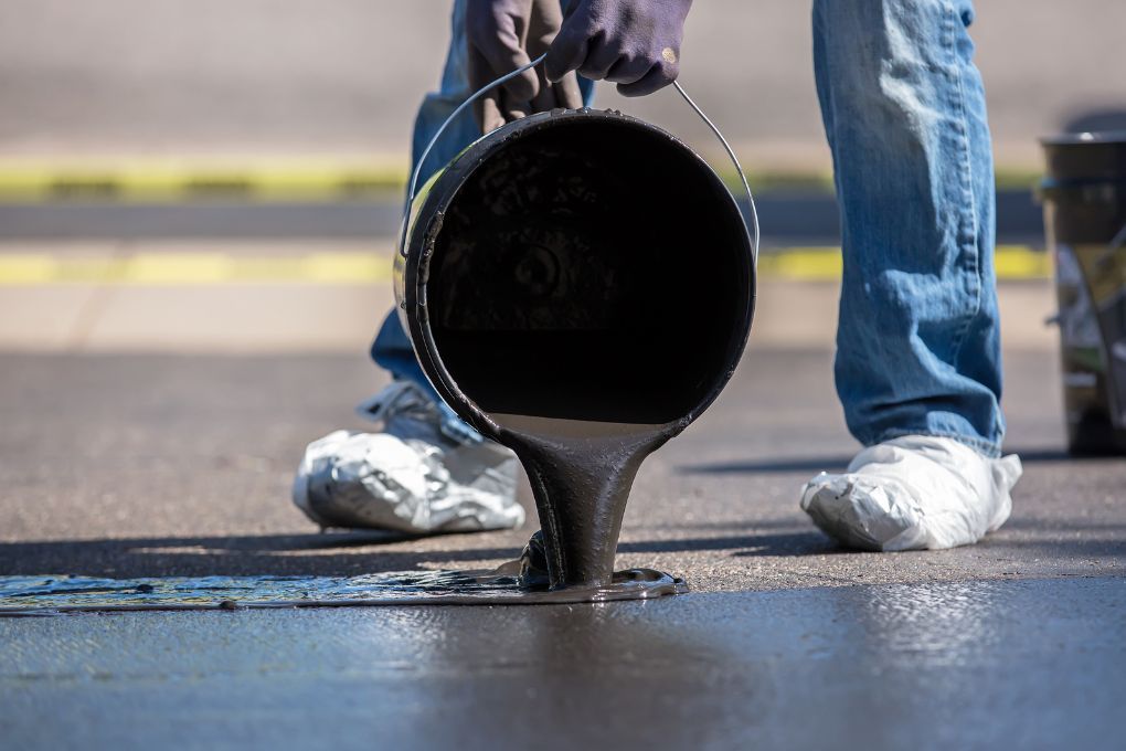 Driveways Sheffield applying selant to a driveway in Sheffield