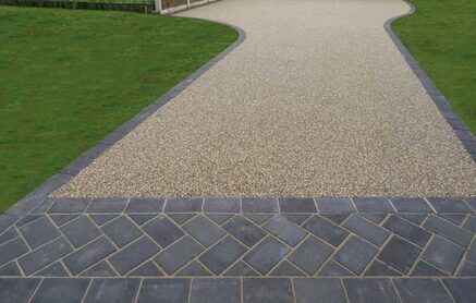 Resin driveway in Sheffield with dark block  paving edging and entrance section