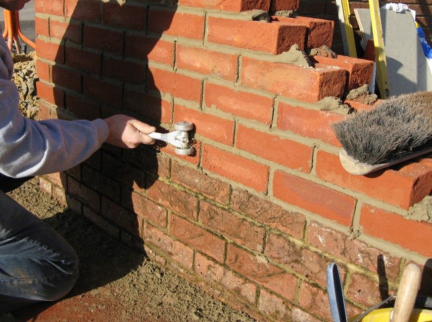 Driveways Sheffield bricklayers raising a garden wall in Sheffield