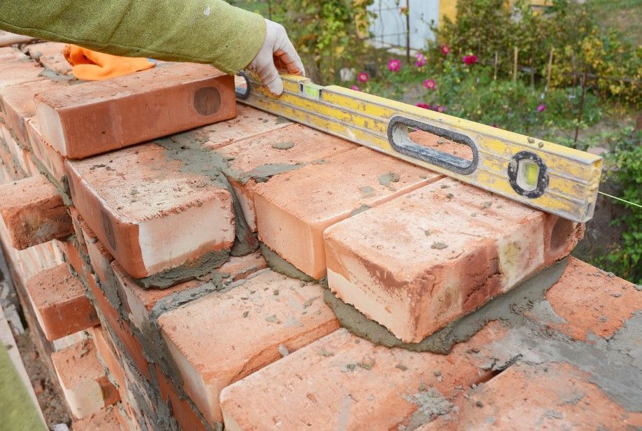 Driveways Sheffield checking levels whilst bricklayingin Sheffield