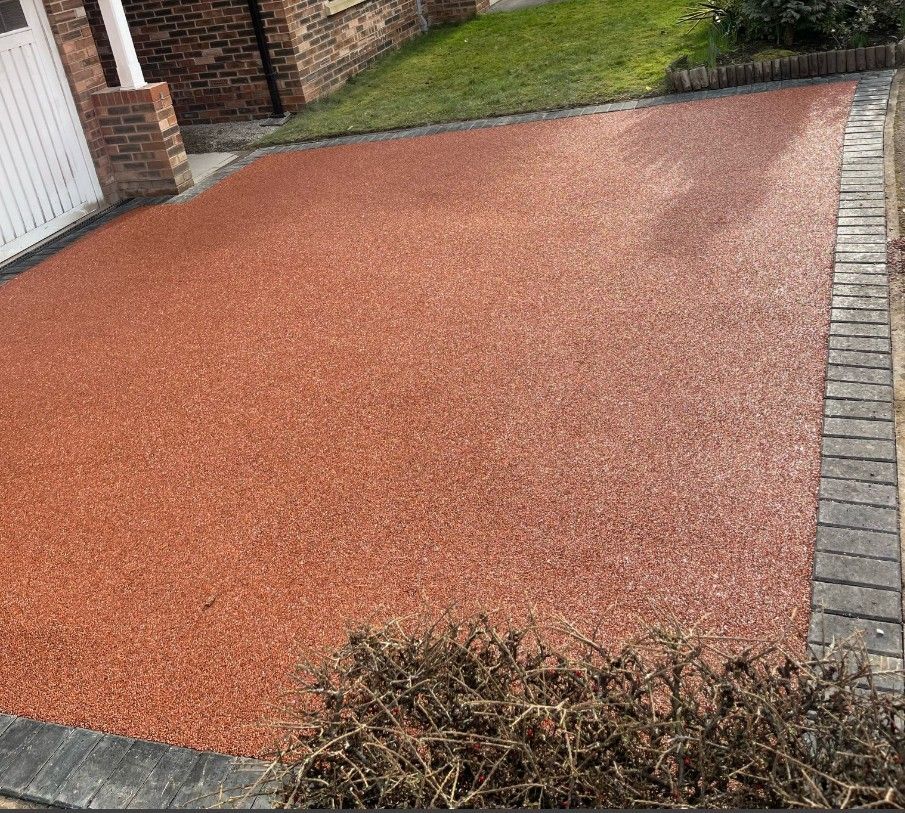 Driveways Sheffield resurfacing a black tarmac driveway to red