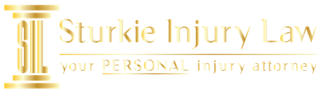 Logo for Sturkie Injury Law, a golden column with gold text "Sturkie Injury Law" and "your PERSONAL injury attorney".