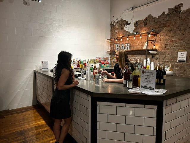 A Bartender Is Preparing a Drink at A Bar - Lee’s Summit, MO - Top Shelf Bartending Services, LLC