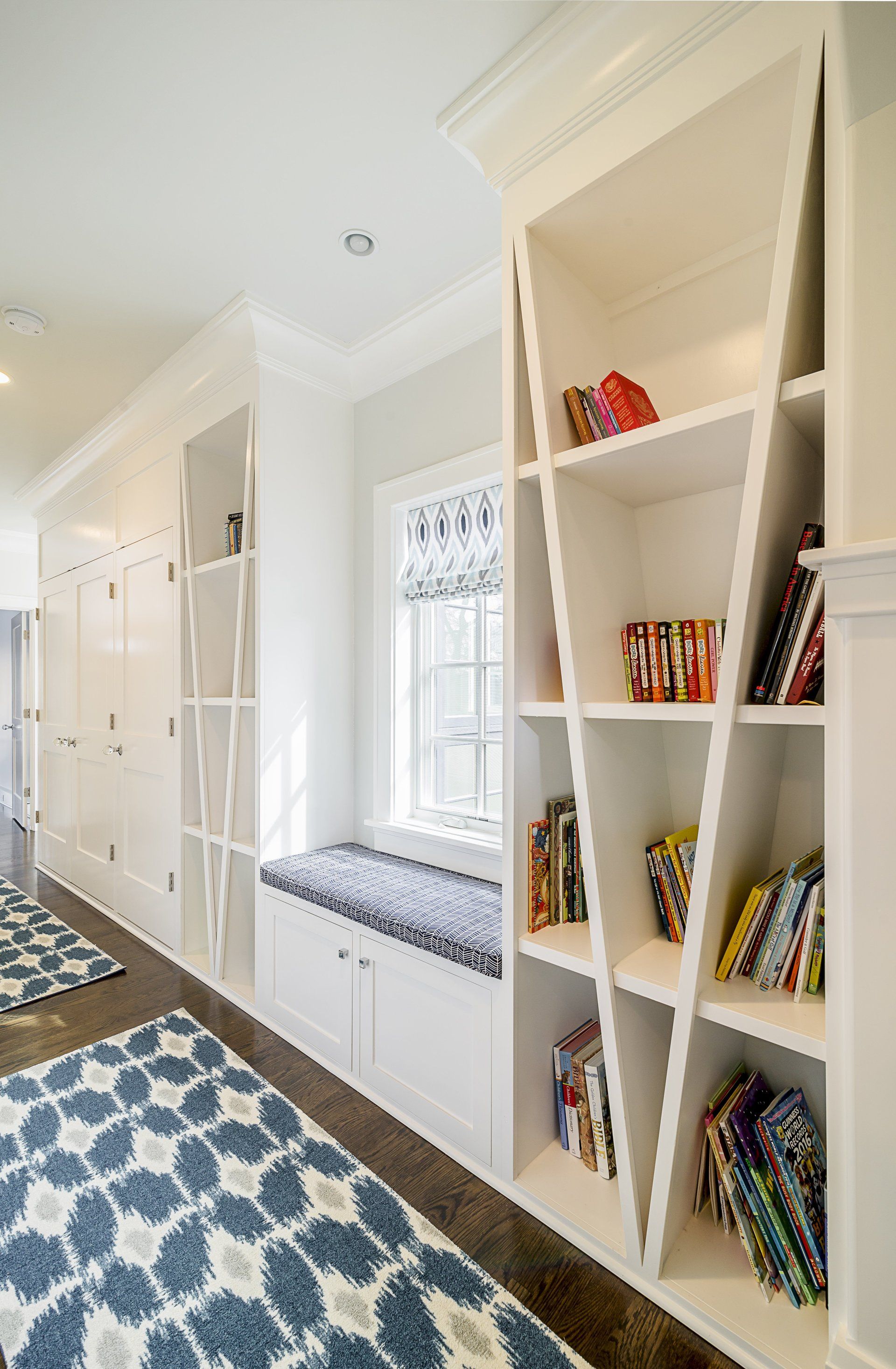 There are many books on the shelves in this room.