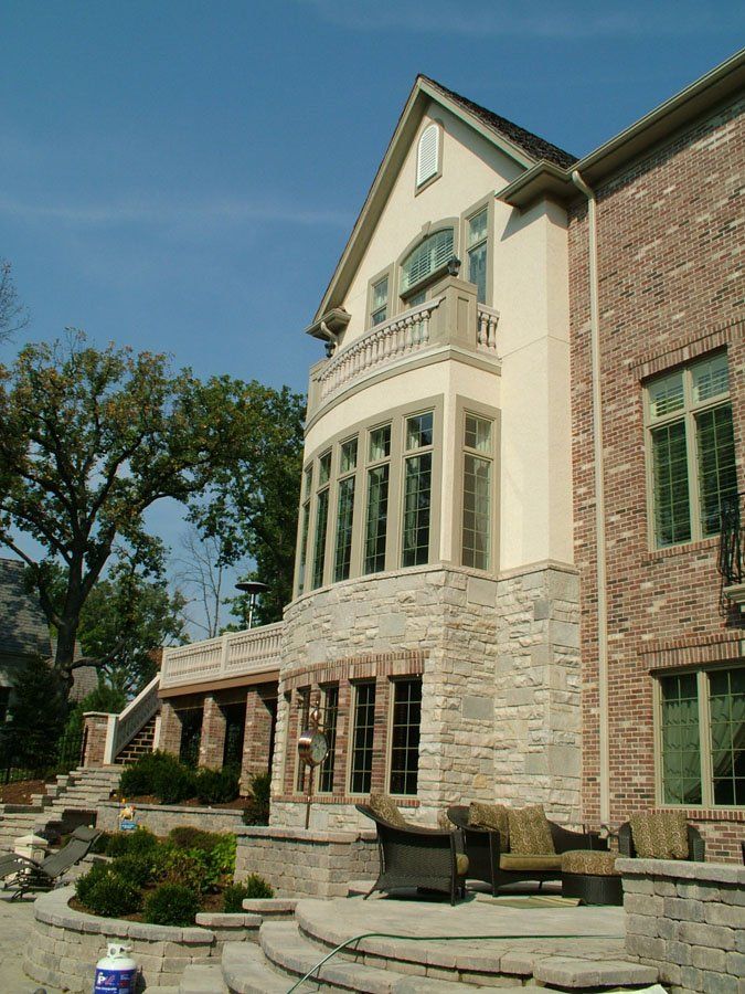 A large house with a lot of windows and stairs