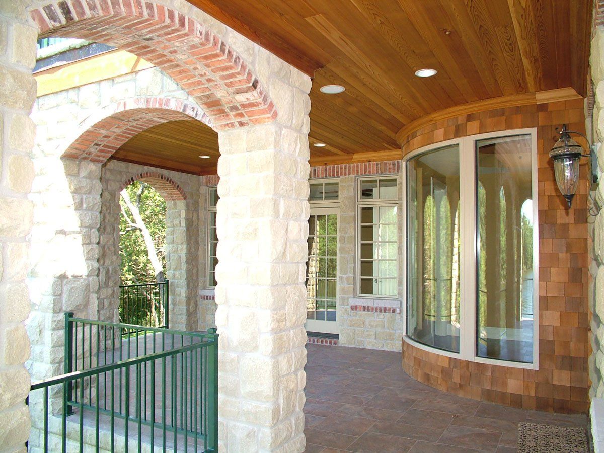 A brick building with arches and a wooden ceiling