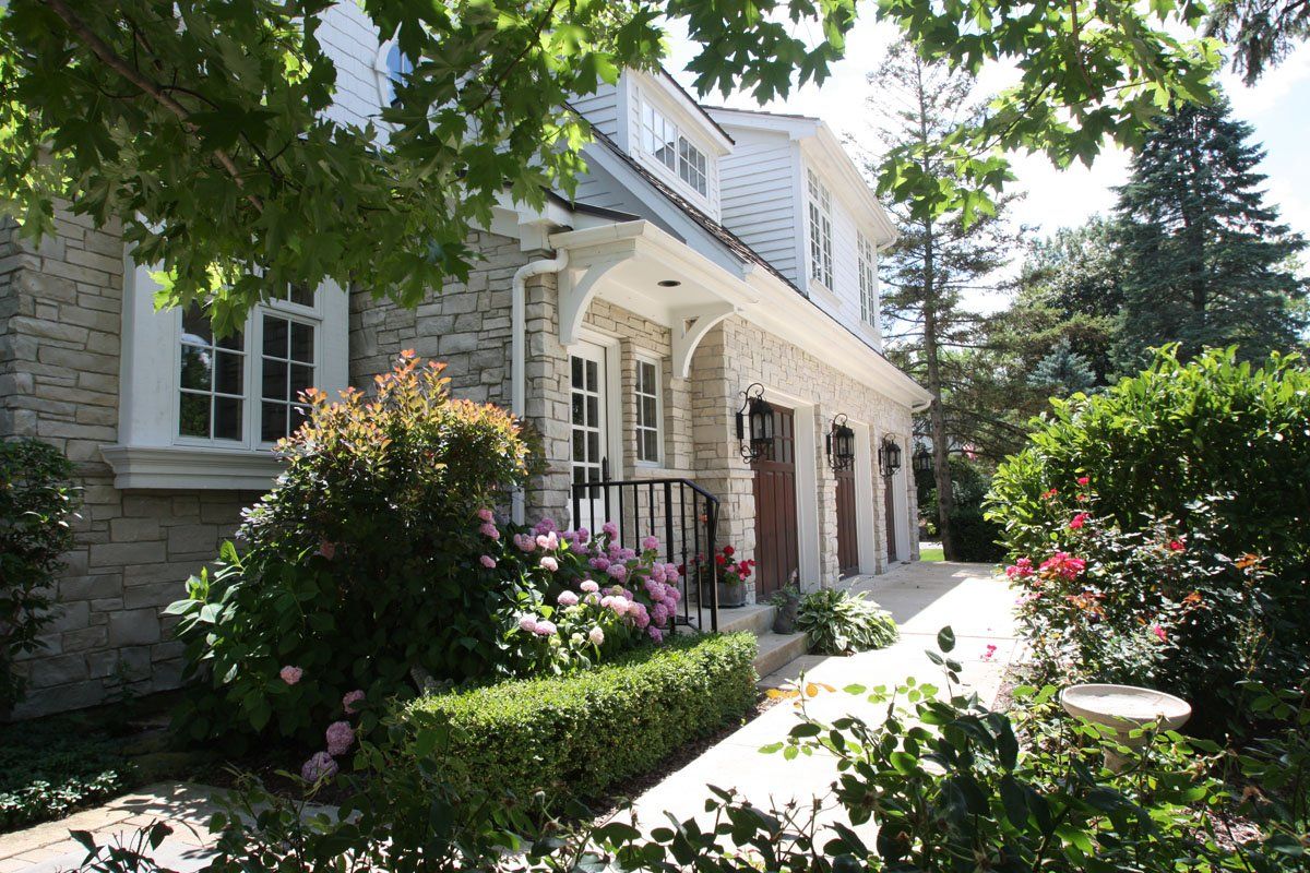 A large house with a walkway leading to it