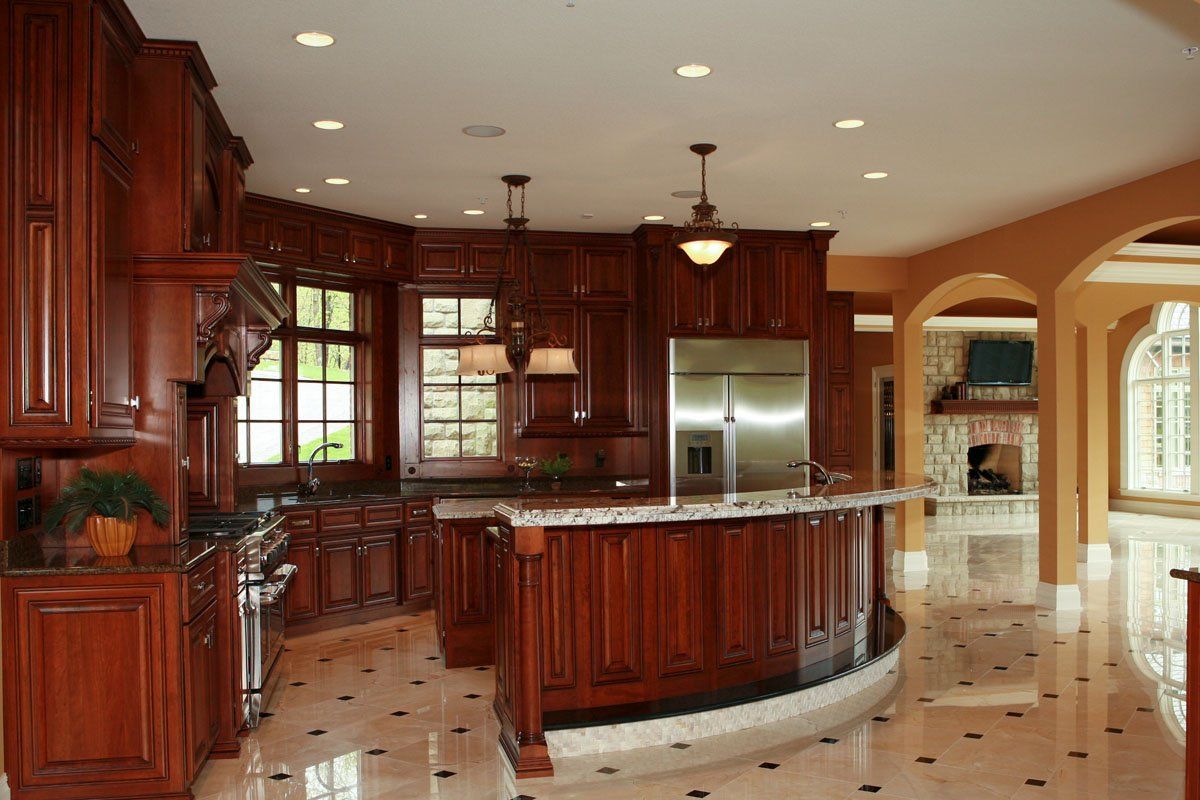 A kitchen with stainless steel appliances and wooden cabinets
