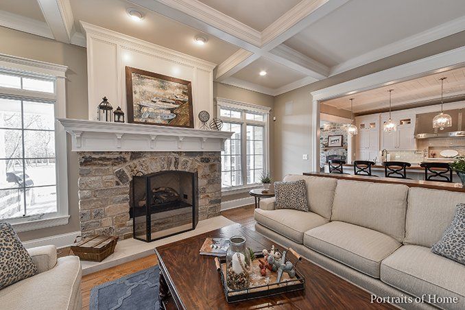 A living room with a fireplace , couch , and coffee table.
