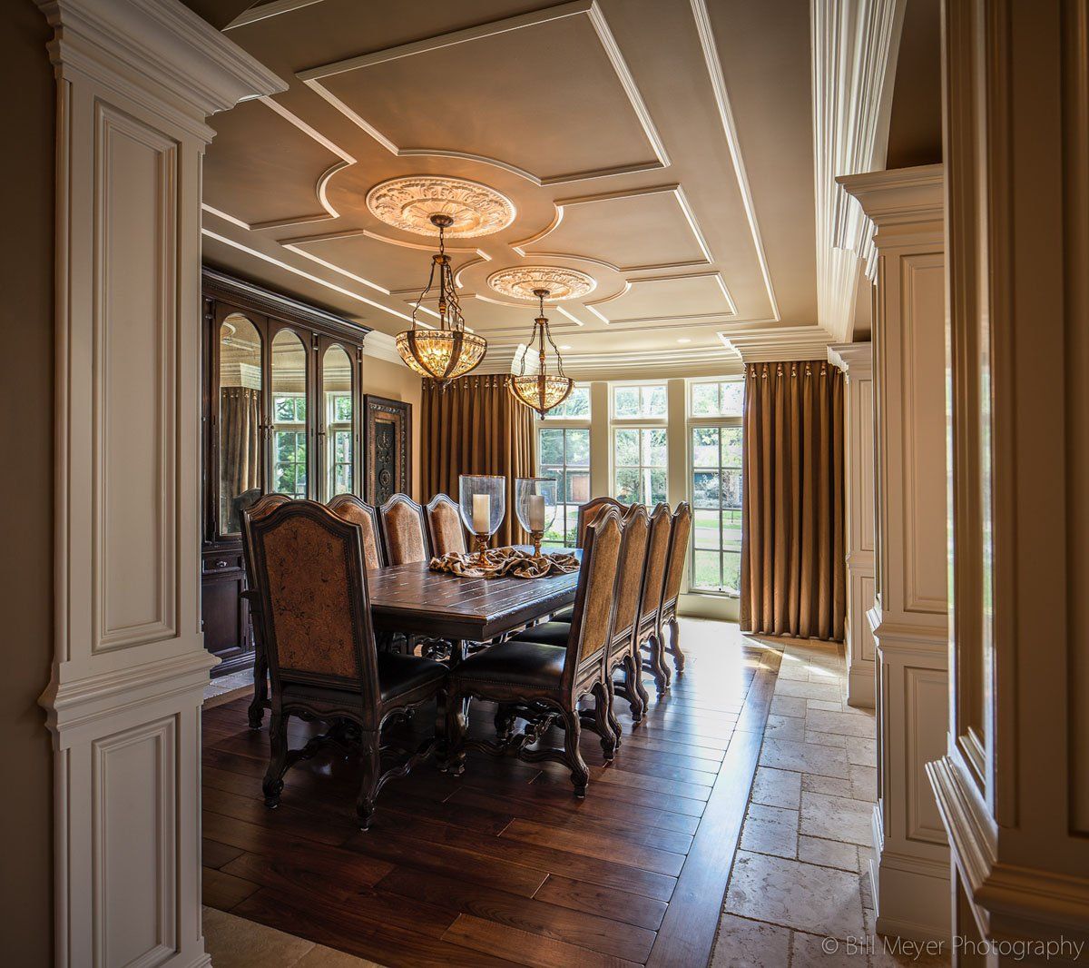 A large dining room with a long table and chairs