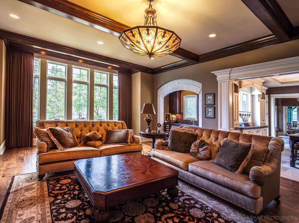 A living room filled with furniture and a chandelier.