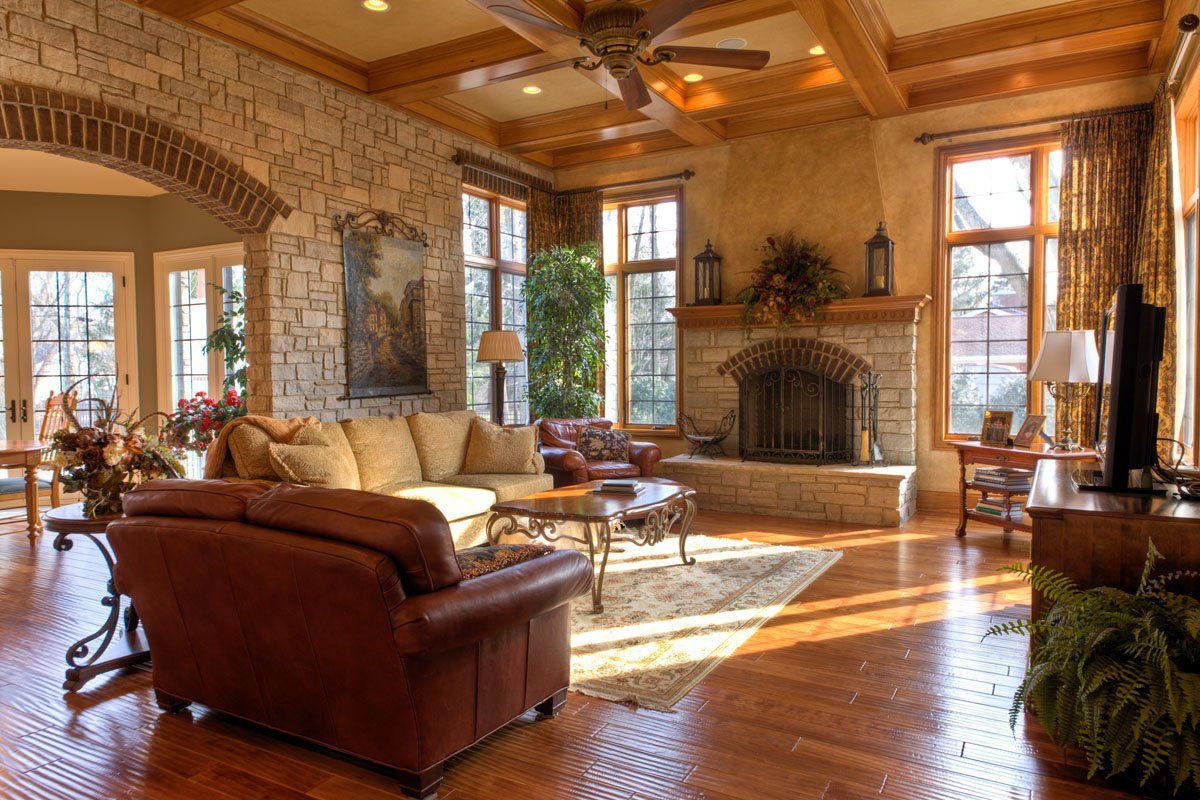 A living room filled with furniture and a fireplace.